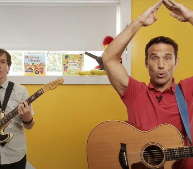 PBS Kids celebrity SteveSongs and his band member Chris and playing guitars and the singing Brush, Brush, Brush song